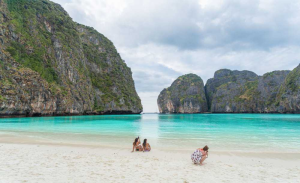 Crystal-clear turquoise waters surrounding the dramatic limestone formations of nearby Phi Phi Islands